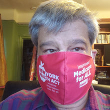 Load image into Gallery viewer, Photo of white presenting man with white and gray short hair. Books on shelves in the background. He is wearing a red NY Health Act face mask. The left side says &quot;New York Health Act universal single-payer care for all&quot; in white letters. The right side says &quot;improved Medicare for All&quot; in white letters and has the PNHP logo and union bug at bottom.
